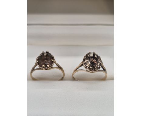 Two 9ct yellow gold and smokey quartz gem stone rings. Ring size O &amp; P. 4.40Grams. 