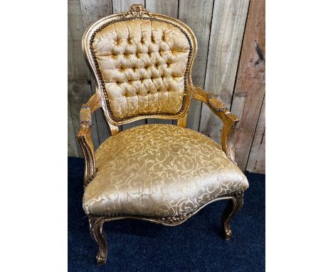 French button back arm chair. Finished in gold leaf and gold material upholstery. 92.5cm. 