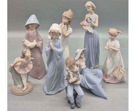 Collection of Eight Spanish porcelain figurines; Nao girl and dove, Nao ballerina girl, Nao boy and dog, Nao girl praying, Na