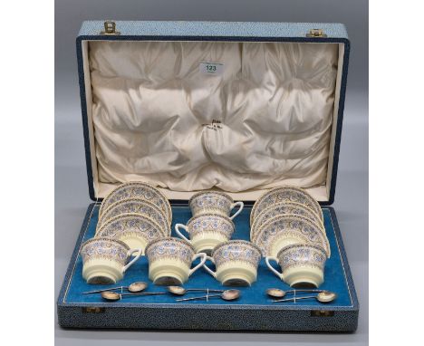 Boxed Royal Worcester "Lady Evelyn" coffee can and saucer set. Comes with Six Sheffield silver Walker &amp; Hall coffee spoon