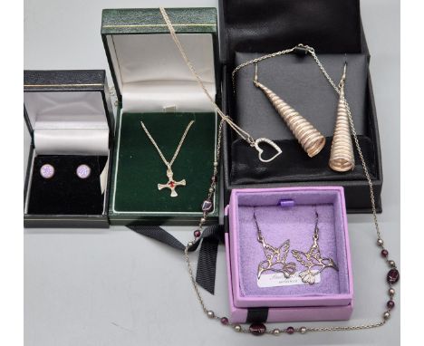Selection of silver jewellery; Silver earrings, cross pendant, heart shaped pendant and other items.
