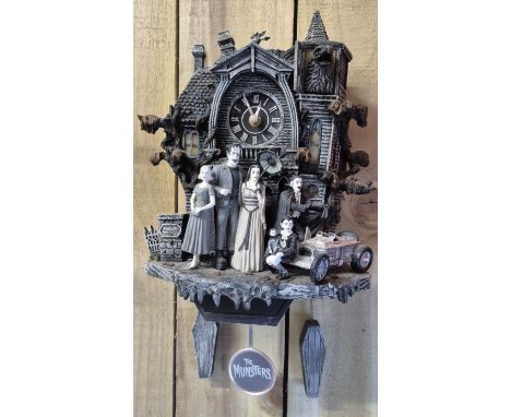 "The Munsters" wall clock with weights &amp; pendulum. Produced by Bradford Exchange.