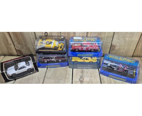 Selection of boxed Scalextrics car models; Caterham Superlight, Ford XB Falcon, Mercury Cougar XR7, ELF Renault RS-01, Ford M