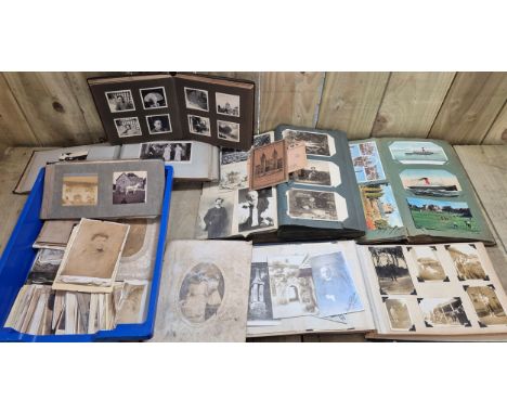 Two small crates of photo and postcard albums. 