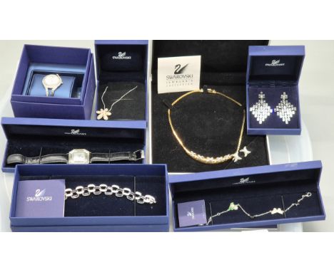 Tray of boxed Swarovski crystal jewellery; Watches, earrings, bracelet and necklaces.