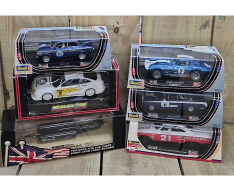 Selection of boxed cars; Scalextrics, Revell boxed cars, Monogram model racing boxed car and Thrust SSC boxed car.