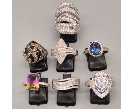 A lot of seven 925 silver and gem stone rings; Silver ring fitted with over 1ct diamonds. Silver, onyx and marcasite ring and