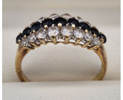 9ct yellow gold, CZ and Sapphire stone ring. 3.39grams. Ring size R.