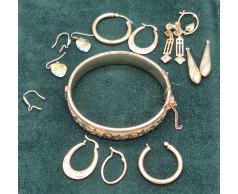 Selection of 9ct yellow gold earrings and 9ct metal core bangle. 6.84grams- 9ct. Bangle- 21.46grams. 