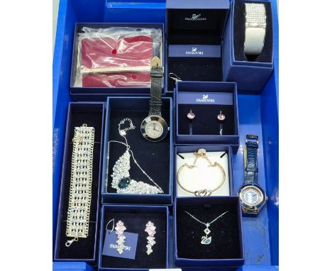 Collection of Swarovski crystal jewellery; Two watches, Necklaces, purse, bangles, earrings and bracelet.