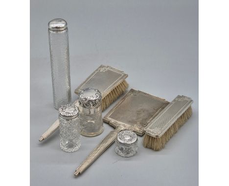 Selection of silver dressing table utensils; Birmingham silver hand mirror and two matching brushes. Together with four silve