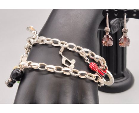 Thomas Sabo silver jewellery; Two silver charm bracelets with various silver and enamel charms and a pair of silver and gem s