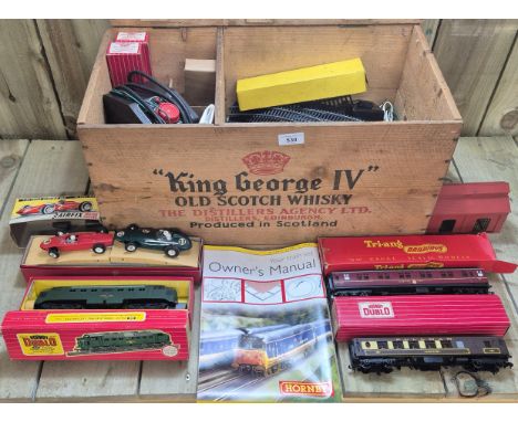 Antique King George IV Old Scotch Whisky crate containing a collection of Hornby Dublo train items. 