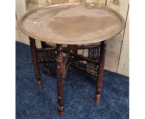 Antique Indian brass top side table. Wooden trestle base. 56x60cm 