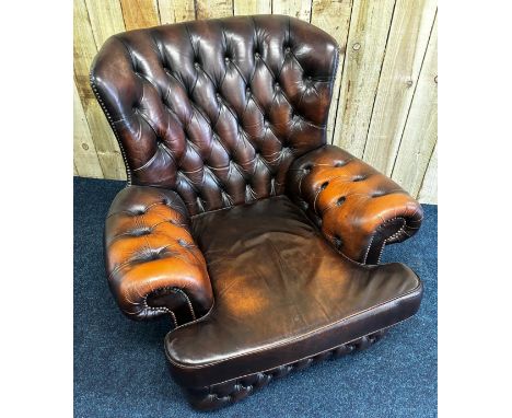 Brown leather Chesterfield button back arm chair. 91cm in height. 