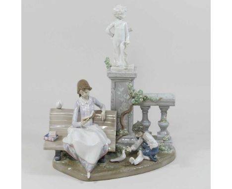 A Lladro porcelain figure group, of a mother and child, shown seated before a balustrade31cm highCondition report: Overall co