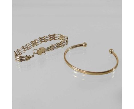 A 9 carat gold bangle, of plain design, 3.5g, 6.5cm wide, together with a 9 carat gold gate bracelet, with a padlock shaped c
