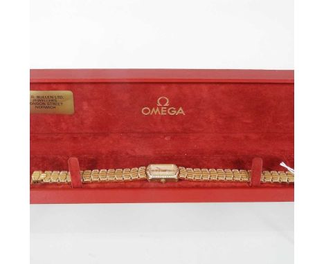 An 18 carat gold and diamond set Omega ladies wristwatch, having a blind mother of pearl dial, and diamond set bezel, on a fl