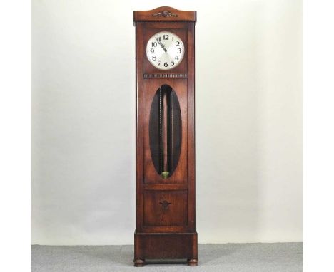 A 1930's oak cased longcase clock, having a thirty day movement and Westminster chimes200cm highCondition report: Dial measur