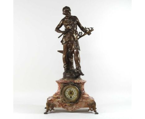 A 19th century French marble mantel clock, having a painted dial, the case surmounted by a spelter figure of a blacksmith aft
