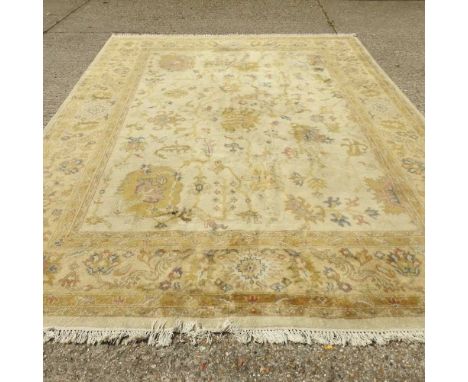 An Iranian woollen rug, all over design on cream ground, 360 x 274 cmCondition report: Dirty, stained and marked across most 