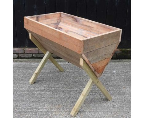 A wooden garden planter, on stand100cm wide