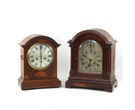 An Edwardian oak and inlaid cased bracket clock, having an eight day movement, 38cm high, together with another bracket clock