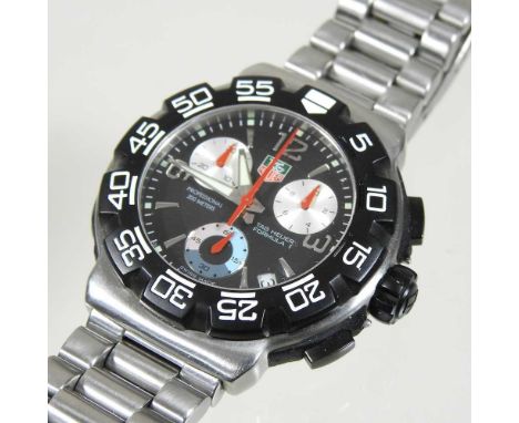 A modern Tag Heuer steel cased gentleman's diver's wristwatch, with a signed black dial, inscribed 200m professional, on a br