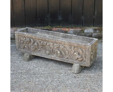 A reconstituted stone garden planter, of rectangular shape, on paw feet89cm wide