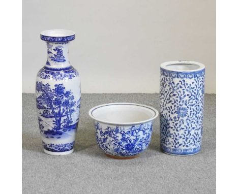 A blue and white glazed pottery stick stand, together with a vase and a bowl (3)Vase 62cm high