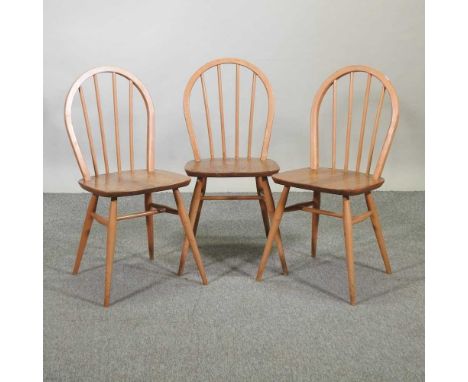 A set of three Ercol light elm spindle back dining chairs