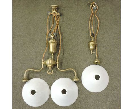 An early 20th century brass adjustable ceiling light, with a rise and fall counterweight