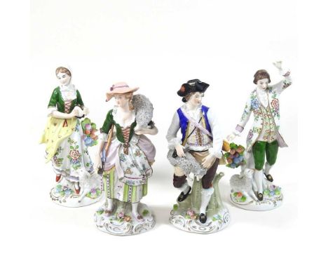 A pair of Sitzendorf porcelain figures, of a lady and a gentleman, together with another pair, printed marks to base (4)21cm 