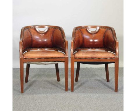 A pair of 20th century hardwood and tan leather upholstered tub chairs, on tapered square legsCondition report: They are both