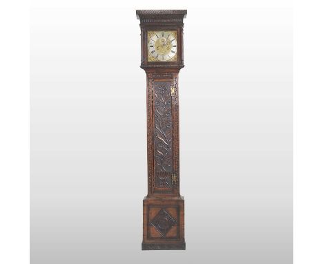 A Charles II or late 17th century oak cased longcase clock, later decorated with flowers and foliage, the eleven inch brass d