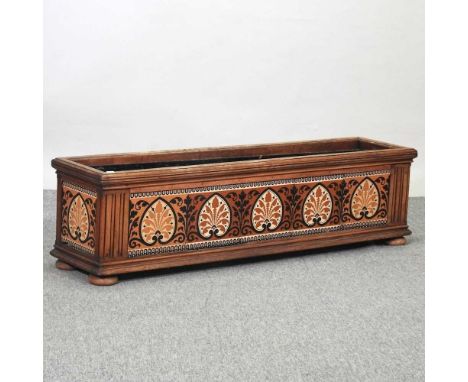 An Edwardian walnut planter, inset with tiles, on bun feet123w x 30d x 33h cmCondition report: Solid and usable. The liner is