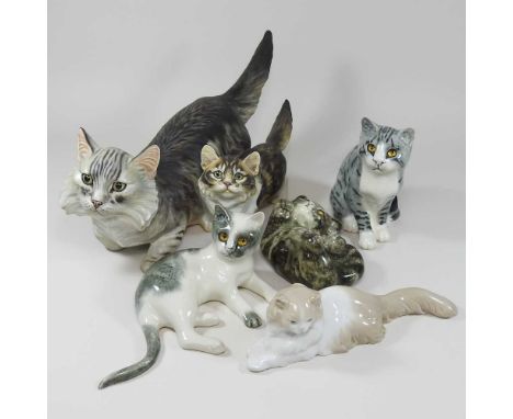 A Janus Studio pottery figure group, of a cat and kitten, designed and modelled by Peggy Davies, together with Three Mike Hin