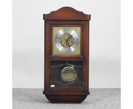A 1930's oak cased wall clock, with a gilt metal dial67cm highCondition report: Overall looks to be complete. The movement lo