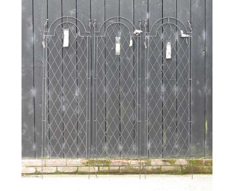 A set of three metal garden trellis, each 177cm high