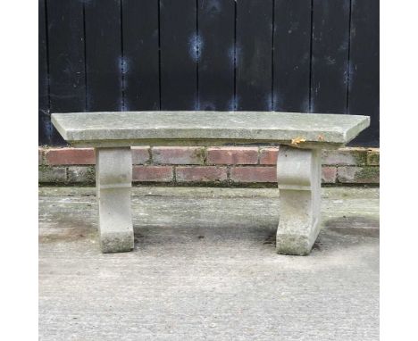 A reconstituted stone garden bench, of curved shape107w x 36d x 41h cm