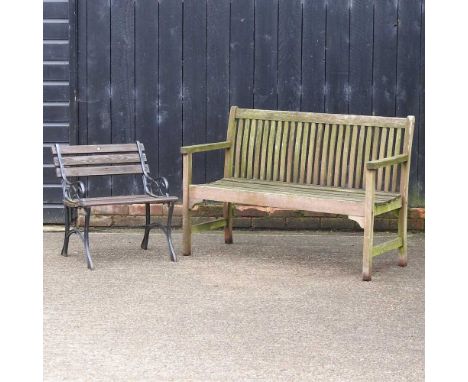 A wooden slatted garden bench, together with a black painted metal and wooden slatted garden armchair (2)Bench 122w x 54d x 8