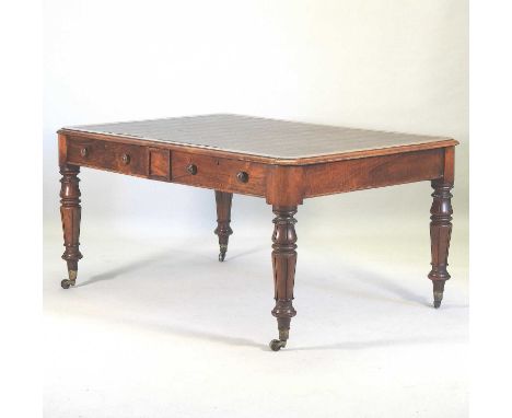 A William IV walnut partners writing table, with an inset writing surface, containing a pair of frieze drawers to each side, 