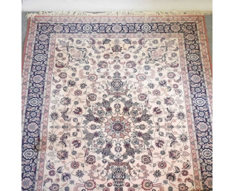 A large Persian carpet, with all over floral designs, on cream ground, 360 x 273cmCondition report: Overall light wear and di