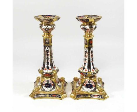 A pair of Royal Crown Derby 'Old Imari' pattern table candlesticks, each on a shaped square base, printed marks to base27cm h