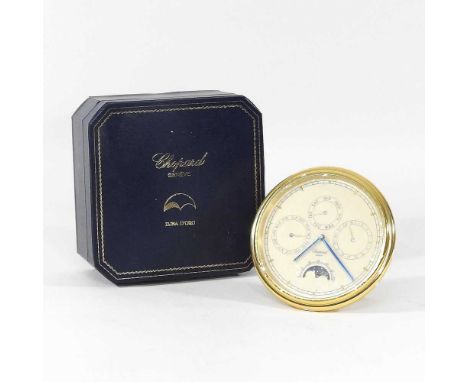 A Chopard brass cased desk calendar, in original box, 15cm in diameter