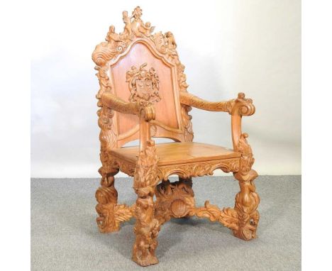 A 20th century Italian light oak throne chair, profusely carved with putti and foliage throughout72w x 59d x 123h cm