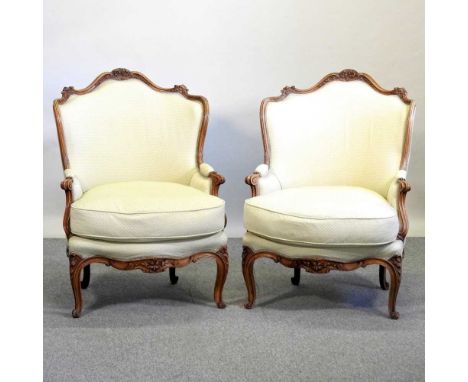 A pair of late 19th century French walnut and cream upholstered show frame armchairs, on cabriole legs75cm wideCondition repo
