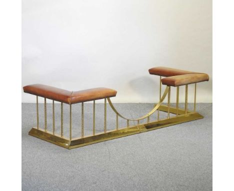 A tan leather upholstered brass club fender, 20th century, with a padded top, on square supports183w x 65d x 48h cm outside b