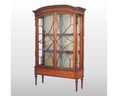 A good quality Edwardian satinwood display cabinet, painted with flowers and festoons, enclosed by a pair of astragal glazed 