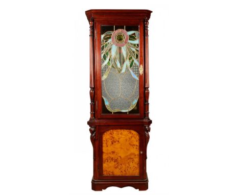 Modernist display cabinet, circa 1900.Carved wood, root veneer and leaded glass.Measurements: 187 x 61.5 x 38 cm.Modernist di